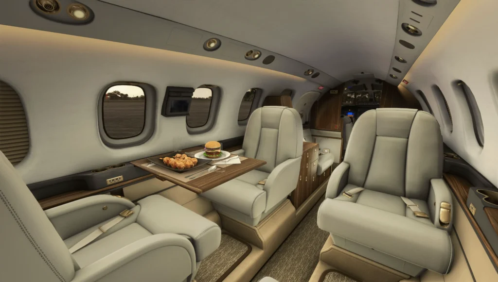 Intérieur de P180 dans un simulateur avec de la nourriture sur la table du plateau