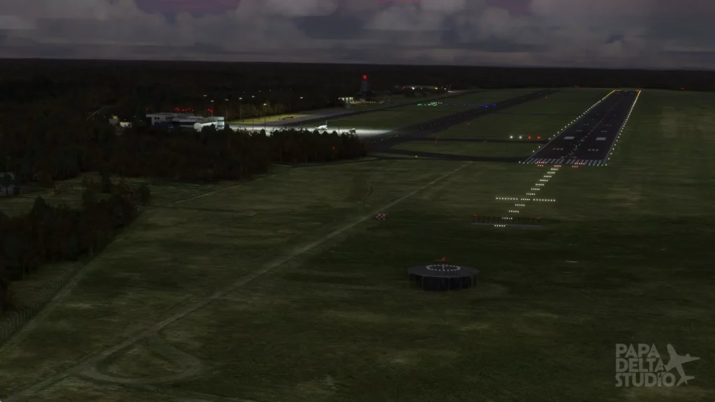Papa Delta Szczecin Goleniow montrant une piste et un éclairage ambiant la nuit
