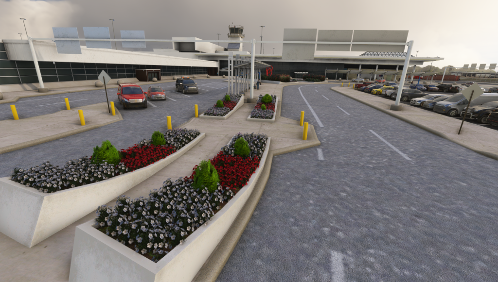 Aire de dépose/prise en charge des véhicules devant l'entrée du terminal de l'aéroport KLIT