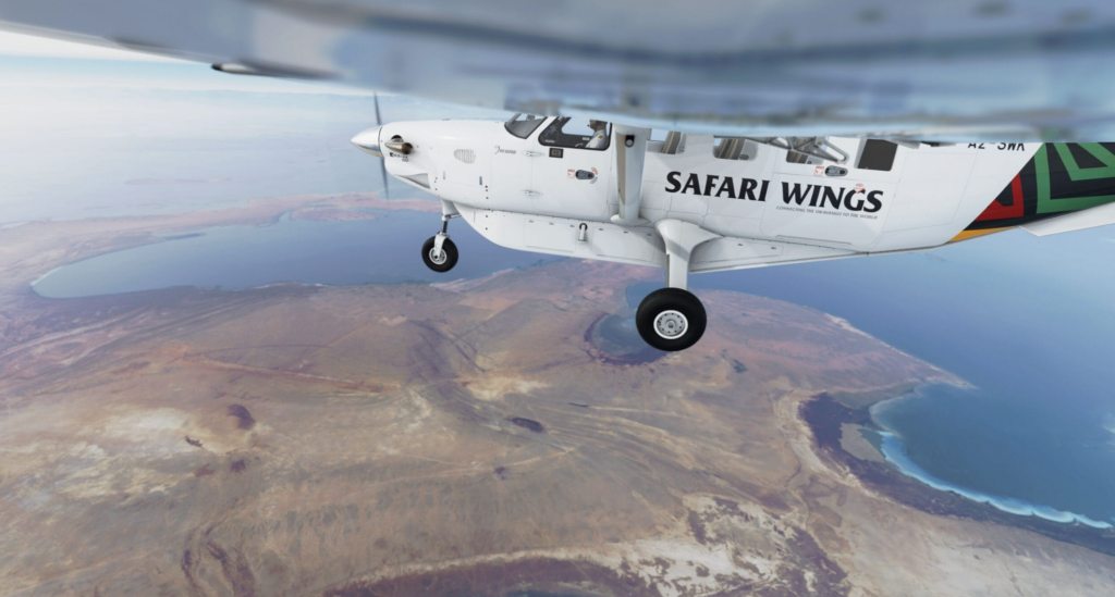 Kodiak 100 MSFS 2024 de SimWorks Studios survolant un environnement réaliste du littoral