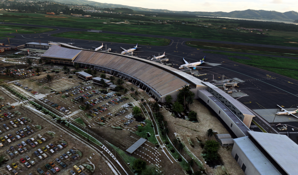 Une autre perspective du terminal et de l'aire de trafic de l'aéroport international Aimé Césaire avec des avions stationnés dans Microsoft Flight Simulator